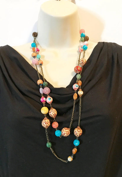 Unleash your wild side with this 60" beaded vintage necklace! Boldly combining vibrant colors, unique shapes, and intricate patterns, it is in excellent condition and ready for any adventure.