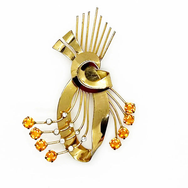 This is a massive Coro Sterling Floral Spray &amp; Ribbon Design brooch. Get mesmerized by the splendor of this vintage brooch, measuring just under 4 inches. The bouquet, intricately designed with a bow, boasts of four gold-toned lines adorned with round, citrine-orange stones of varying sizes.