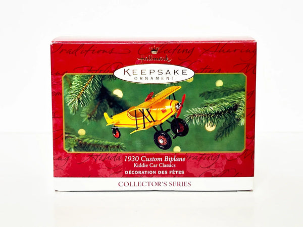 Perfect for collectors and aviation fans: our Hallmark Keepsake Ornament 1930 Custom Biplane provides nostalgic charm with a spinning propeller. Shop today!