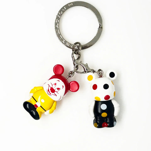 Dopey, from Snow White and the Seven Dwarves;appears as a clown themed Vinylmation Jr.stylized version of himself with a Mickey theme, along with a polka-dotted version.