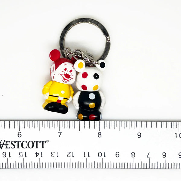 Dopey, from Snow White and the Seven Dwarves;appears as a clown themed Vinylmation Jr.stylized version of himself with a Mickey theme, along with a polka-dotted version.