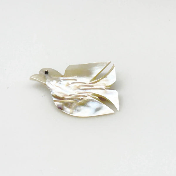 Perfect for vintage jewelry lovers: our Hand Carved Vintage Mother of Pearl Peace Dove Pin- 1960s provides a timeless symbol of peace. Shop today!