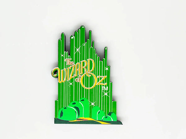Bring a touch of classic Hollywood magic to your collection with this charming wooden Emerald City shelf sitter from Sheila's Collectibles. Crafted in the 1990s, this iconic piece captures the whimsical green spires of Oz in meticulous detail, complete with "The Wizard of Oz" branding.