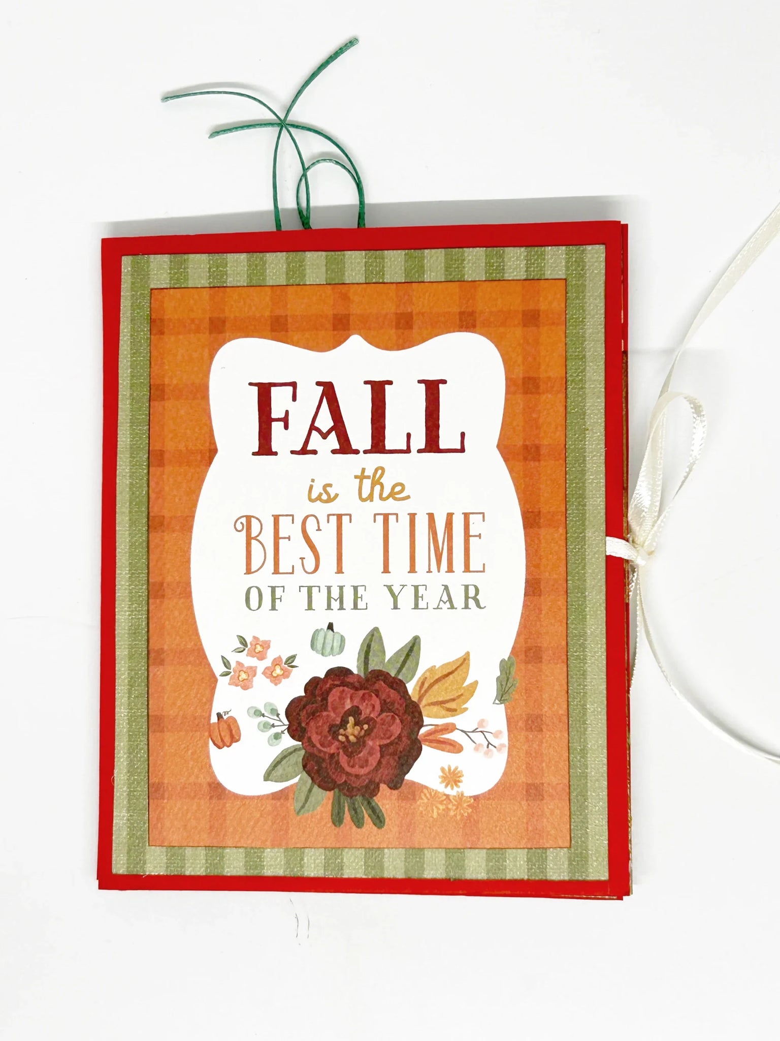 Decorative card with 'Fall is the Best Time of the Year' text and autumnal design on an orange and green striped background.