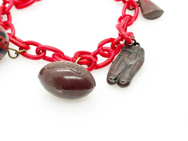 Perfect for sports fans: our Vintage 1930s Plastic Football Charm Bracelet provides unique vintage style and spirited game-day flair. Shop today!