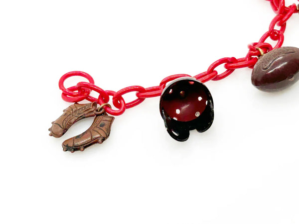 Perfect for sports fans: our Vintage 1930s Plastic Football Charm Bracelet provides unique vintage style and spirited game-day flair. Shop today!