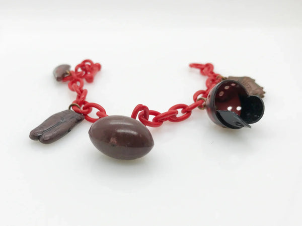 Perfect for sports fans: our Vintage 1930s Plastic Football Charm Bracelet provides unique vintage style and spirited game-day flair. Shop today!