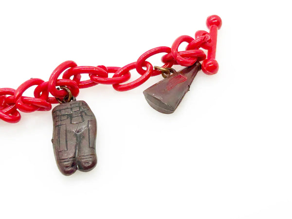 Perfect for sports fans: our Vintage 1930s Plastic Football Charm Bracelet provides unique vintage style and spirited game-day flair. Shop today!