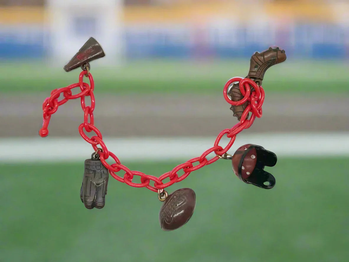 Perfect for sports fans: our Vintage 1930s Plastic Football Charm Bracelet provides unique vintage style and spirited game-day flair. Shop today!