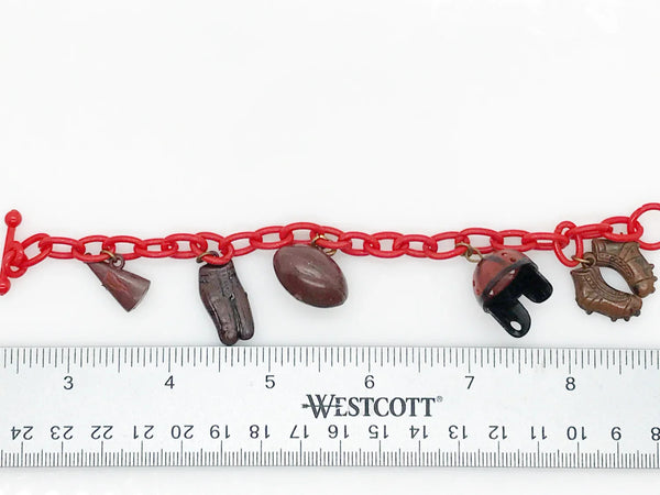 Perfect for sports fans: our Vintage 1930s Plastic Football Charm Bracelet provides unique vintage style and spirited game-day flair. Shop today!