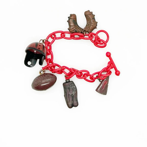 Perfect for sports fans: our Vintage 1930s Plastic Football Charm Bracelet provides unique vintage style and spirited game-day flair. Shop today!