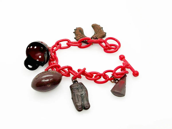 Perfect for sports fans: our Vintage 1930s Plastic Football Charm Bracelet provides unique vintage style and spirited game-day flair. Shop today!