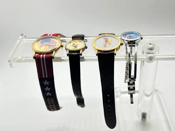 This is a group of four ladies' watches featuring graphic designs - an American flag, Mickey Mouse, a hot dog and a snowman. I don't know if any work, or just require batteries or can be repaired.  The lot would also provide parts for other watches or even craft projects. They are untested.