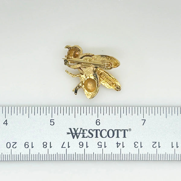 This Gerry's vintage golden bee brooch boasts exquisite detailing, ensuring a 1 1/2" inch wide diameter that presents in mint condition.