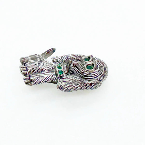 This vintage brooch shows an adorable, floppy eared puppy dog. He has bright green eyes and collar and wagging tail. He's just waiting for you!! His coat is well detailed in silver tone metal. He or she measures 1 3/4" tall and is marked "Gerry's" in capitals on the white enamel back.