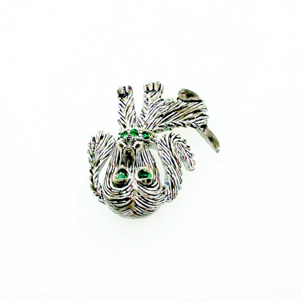 This vintage brooch shows an adorable, floppy eared puppy dog. He has bright green eyes and collar and wagging tail. He's just waiting for you!! His coat is well detailed in silver tone metal. He or she measures 1 3/4" tall and is marked "Gerry's" in capitals on the white enamel back.