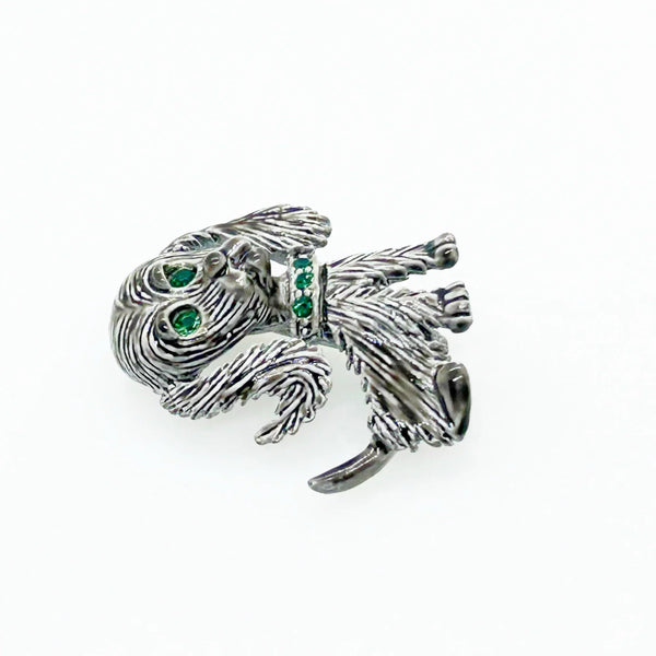 This vintage brooch shows an adorable, floppy eared puppy dog. He has bright green eyes and collar and wagging tail. He's just waiting for you!! His coat is well detailed in silver tone metal. He or she measures 1 3/4" tall and is marked "Gerry's" in capitals on the white enamel back.