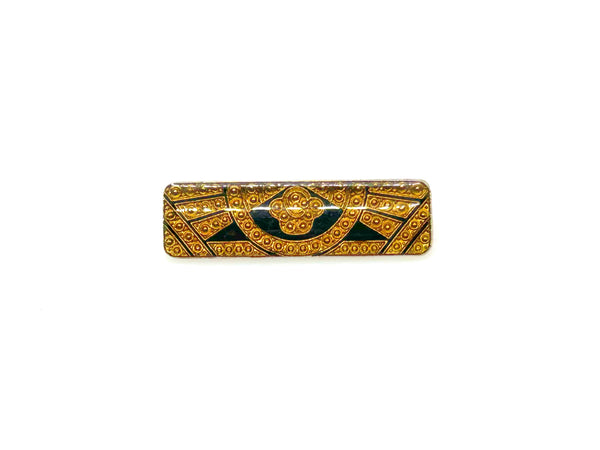 A vintage rectangular Art Deco revival bar brooch in the Pierre Bex style, featuring textured gold-tone metal sunburst rays, dark enamel details, and a central floral cloud medallion against a solid white background