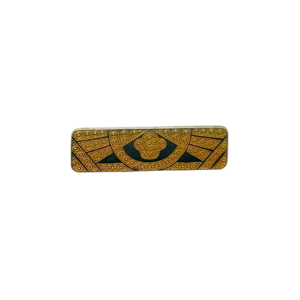 A vintage rectangular Art Deco revival bar brooch in the Pierre Bex style, featuring textured gold-tone metal sunburst rays, dark enamel details, and a central floral cloud medallion against a solid white background