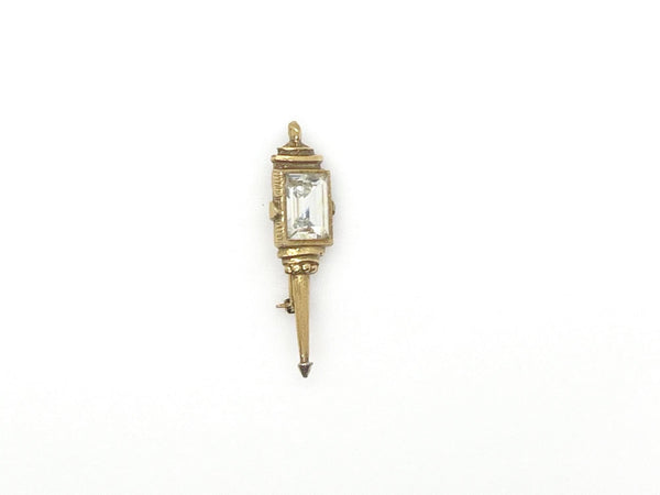 Signed Goldette vintage Victorian Revival gold-tone lantern brooch pin with an emerald-cut clear glass rhinestone