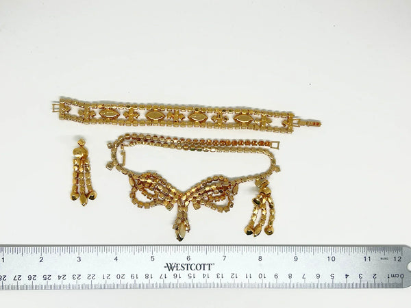 Perfect for discerning collectors: our Vintage Golden Rhinestone Parure provides timeless elegance with bright stones that captivate. Shop today!