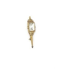 Signed Goldette vintage Victorian Revival gold-tone lantern brooch pin with an emerald-cut clear glass rhinestone
