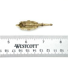 Signed Goldette vintage Victorian Revival gold-tone lantern brooch pin with an emerald-cut clear glass rhinestone