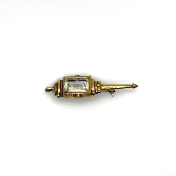 Signed Goldette vintage Victorian Revival gold-tone lantern brooch pin with an emerald-cut clear glass rhinestone
