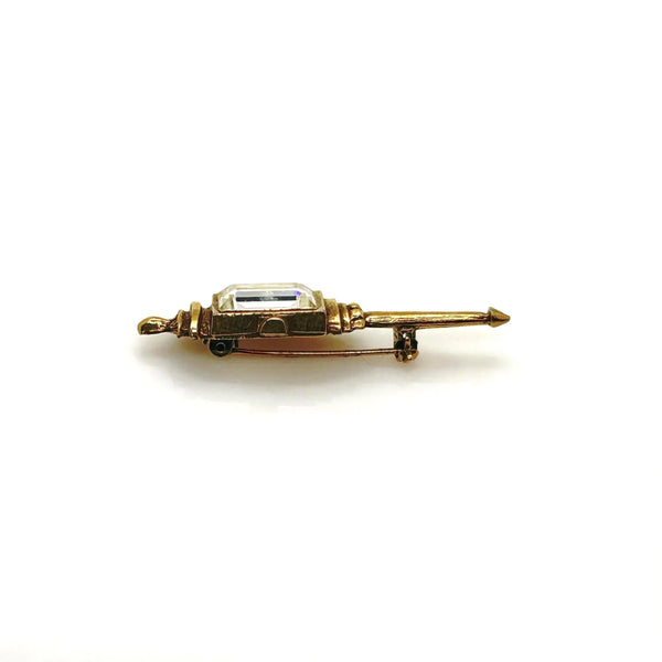 Signed Goldette vintage Victorian Revival gold-tone lantern brooch pin with an emerald-cut clear glass rhinestone