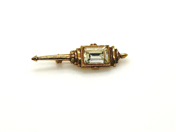 Signed Goldette vintage Victorian Revival gold-tone lantern brooch pin with an emerald-cut clear glass rhinestone