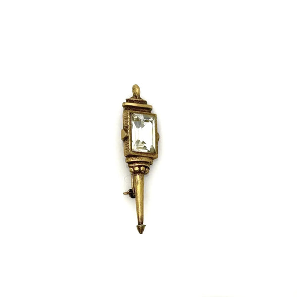 Signed Goldette vintage Victorian Revival gold-tone lantern brooch pin with an emerald-cut clear glass rhinestone