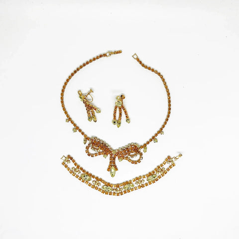 Perfect for discerning collectors: our Vintage Golden Rhinestone Parure provides timeless elegance with bright stones that captivate. Shop today!