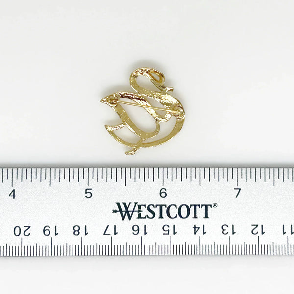 Effortless style meets timeless craftsmanship with this stunning Crown&nbsp; Trifari brooch. Intricate open work detail and elegant design make it the perfect accessory for any occasion. This impeccable, open work swan brooch exudes elegance and stands 1" wide in a statement of sophisticated craftsmanship.