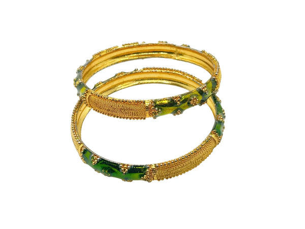 A pair of traditional Indian gold-plated bangles showcasing intricate filigree work and vibrant grass green enamel detailing.