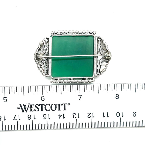 Perfect for vintage jewelry lovers: our Green Square Stone pin provides timeless elegance with a marcasite-studded vintage brooch design. Shop today!