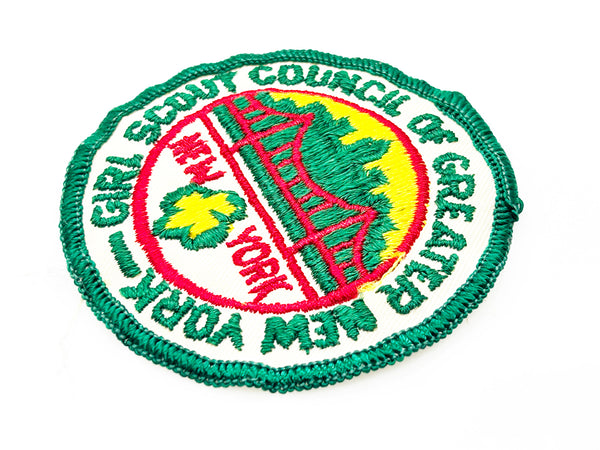 Embroidered patch with 'Girl Scout Council of Greater New York' logo on a white background