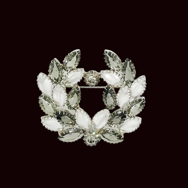 This exquisite brooch showcases stunning marquise stones in various shades of gray and silver, perfectly accented with small shimmering rhinestones. Measuring at 2.25” wide and set in a sleek silver tone, this brooch is a true beauty