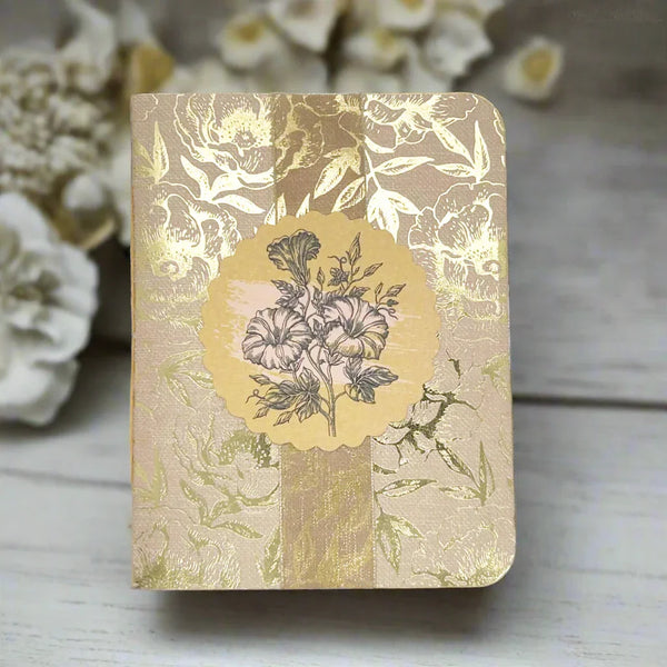 Handcrafted mini album titled Happy Day by Lamorees Vintage. The pale brown cover features shimmering gold foiled floral patterns, a coordinating vertical ribbon, and a line drawing