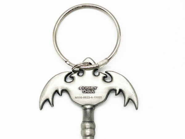 Silver keychain with bat design on a white background