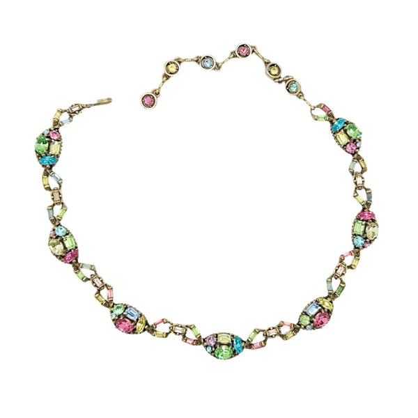 A stunning array of colors and shapes, carefully crafted into a one-of-a-kind piece. With a 4" extender for the perfect fit, this choker is sure to make a statement and add a touch of elegance to any outfit. Don't miss out on this unique and versatile addition to your jewelry collection!