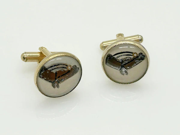 Indulge in timeless sophistication with these exquisite vintage cufflinks featuring an elegant horse design. The larger, 3/4" toggle type pair showcases a majestic brown horse with reins, while the smaller, 1/4" close end bridge style pair adds a touch of opulence with its gold tone metal.