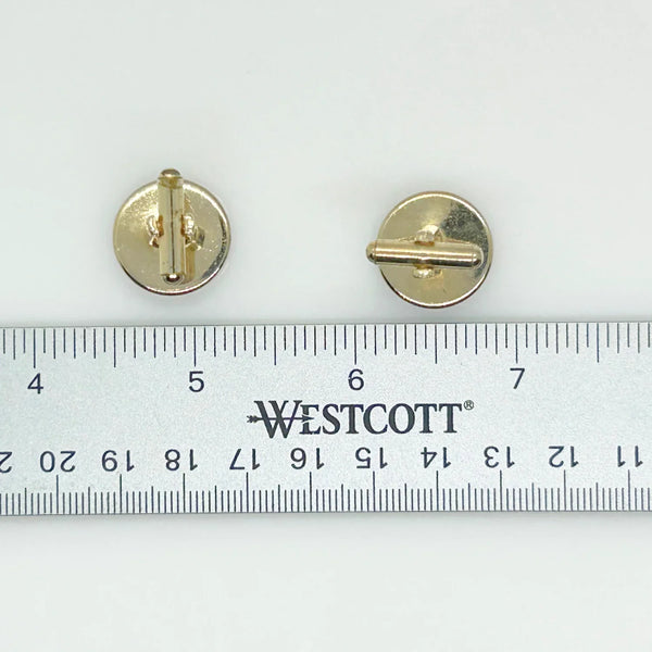 Indulge in timeless sophistication with these exquisite vintage cufflinks featuring an elegant horse design. The larger, 3/4" toggle type pair showcases a majestic brown horse with reins, while the smaller, 1/4" close end bridge style pair adds a touch of opulence with its gold tone metal.