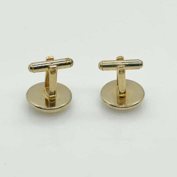 Indulge in timeless sophistication with these exquisite vintage cufflinks featuring an elegant horse design. The larger, 3/4" toggle type pair showcases a majestic brown horse with reins, while the smaller, 1/4" close end bridge style pair adds a touch of opulence with its gold tone metal.