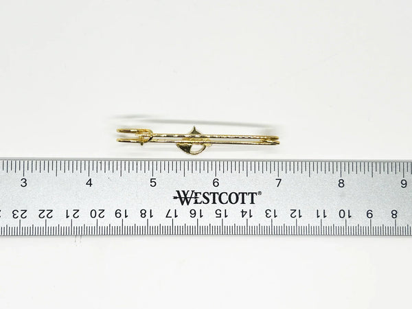 This exquisite gold-tone horse head brooch is perfect for adorning blouses, kilts, or skirts with equestrian elegance. This sophisticated accessory, measuring .25" wide by 2.5" long, presents in impeccable near-mint condition