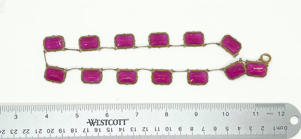 Admire the timeless beauty of our Graceful Vintage Czech Violet Clear Stones Necklace. Handcrafted with thirteen emerald cut purple clear stones encased in intricately detailed frames, this elegant necklace is a true work of art. With a length of approximately 15", it is a delicate and sophisticated addition to any outfit. Experience luxury and exclusivity with this exquisite piece, in very good vintage condition. Free Shipping