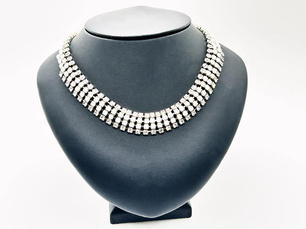 This dazzling choker brings serious sparkle to any outfit! Featuring creamy white milk glass cabochons paired with crystal-clear rhinestones, all nestled in a silvery mesh setting, it's pure vintage, subtle, glamour. 