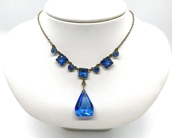 Perfect for jewelry lovers: our Vintage Art Deco Drop Blue Glass Necklace provides a beautiful blue drop design with premium heritage craftsmanship. Shop today!