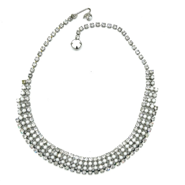 This dazzling choker brings serious sparkle to any outfit! Featuring creamy white milk glass cabochons paired with crystal-clear rhinestones, all nestled in a silvery mesh setting, it's pure vintage, subtle, glamour. 