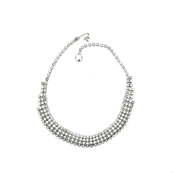 This dazzling choker brings serious sparkle to any outfit! Featuring creamy white milk glass cabochons paired with crystal-clear rhinestones, all nestled in a silvery mesh setting, it's pure vintage, subtle, glamour. 