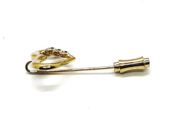 This sweet retro heart stick pin is so charming! It has an openwork design with three smaller hearts along the side. These pins were super popular in the 70s and 80s, perfect for sweaters, blazers, or even scarves. It's 1.5" long and in great shape!